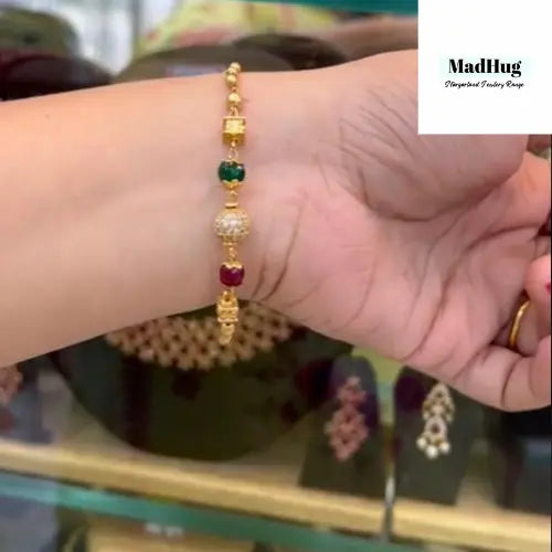Bracelet- Gold with multiple Ball and Beads at MadHug Beauty This is a simple rose gold beautiful and elegant piece to go on any costume any time. Adjustable on most wrist size this is a must have. Get yours now.